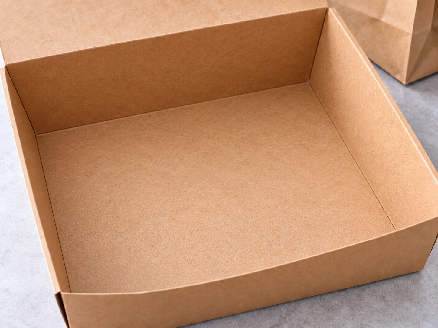 The same takeaway box, empty and ready for the dish